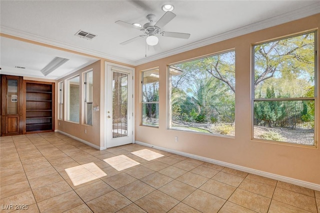 unfurnished sunroom featuring ceiling fan