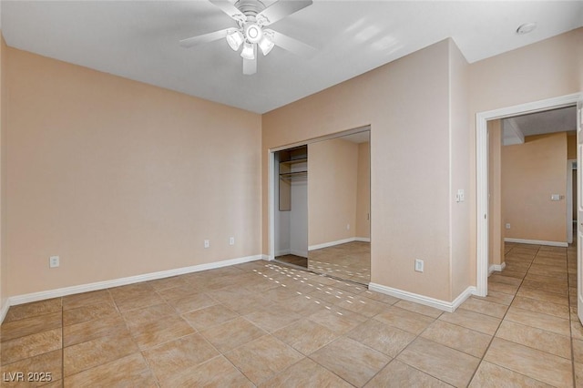 unfurnished bedroom with ceiling fan, light tile patterned floors, and a closet