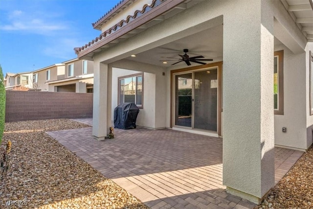 view of patio featuring grilling area and ceiling fan