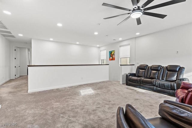 living room featuring ceiling fan and light carpet