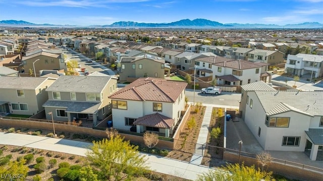 birds eye view of property featuring a mountain view