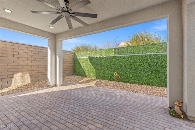 view of patio with ceiling fan