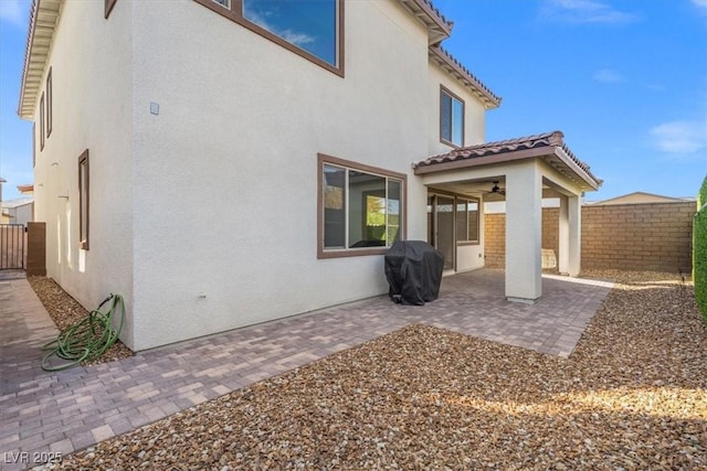 rear view of property featuring a patio area