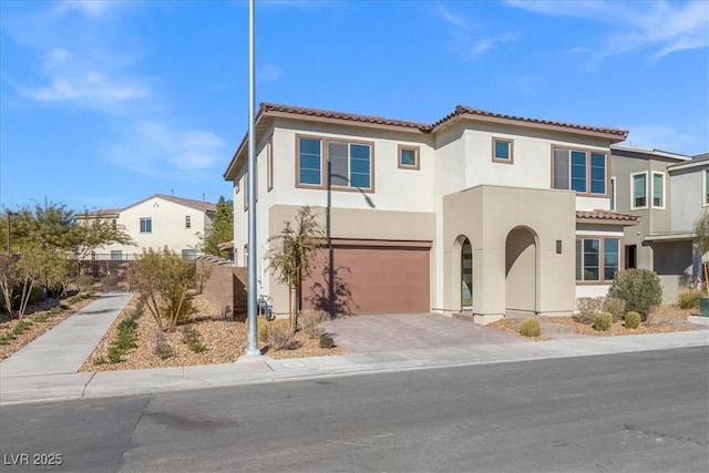 mediterranean / spanish-style house featuring a garage