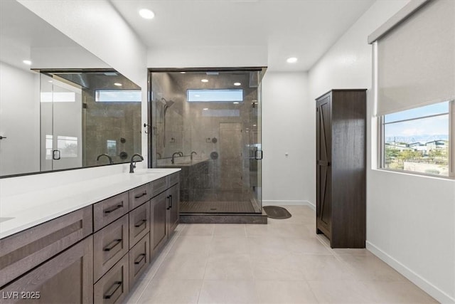 bathroom with tile patterned flooring, vanity, and an enclosed shower