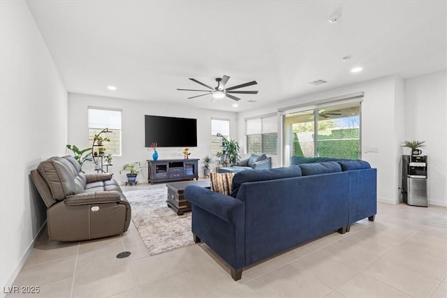 tiled living room featuring ceiling fan