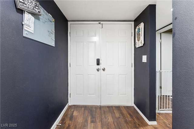 entryway with dark hardwood / wood-style floors