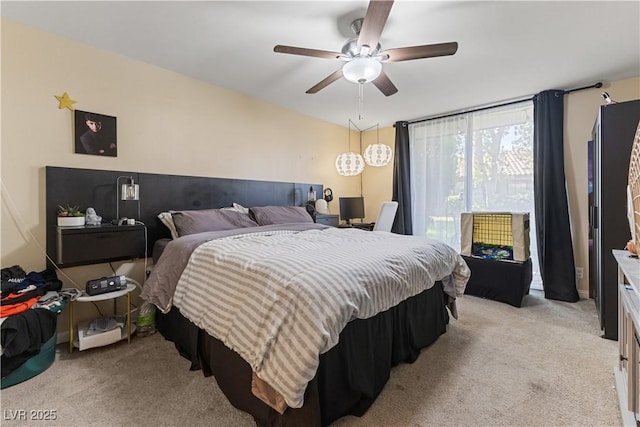 bedroom with light carpet and ceiling fan