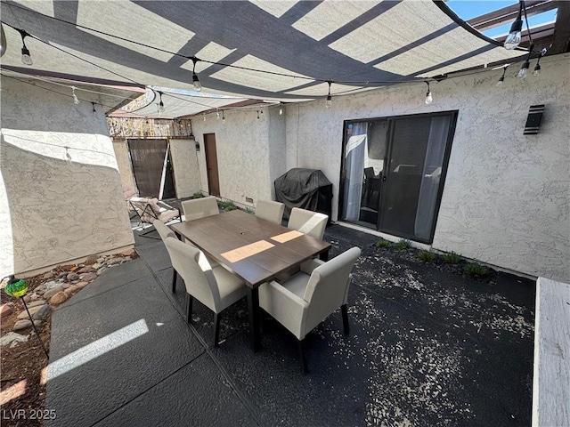 view of patio / terrace featuring a grill, outdoor dining area, and a pergola