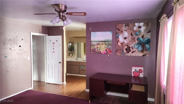 bedroom with hardwood / wood-style flooring and sink