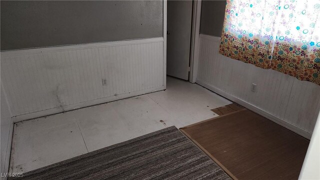 unfurnished room featuring concrete flooring