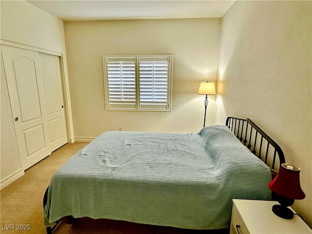 carpeted bedroom with a closet