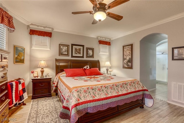 bedroom with ceiling fan, ornamental molding, and light hardwood / wood-style flooring