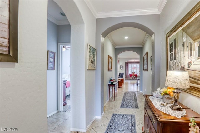 hallway featuring light tile patterned flooring and crown molding