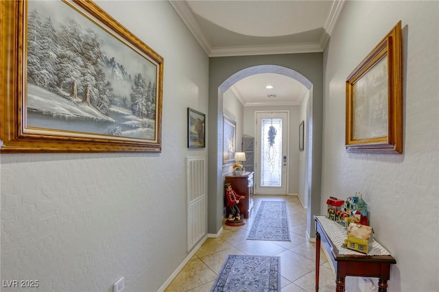 doorway featuring light tile patterned floors and ornamental molding