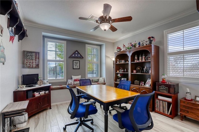 office space featuring light hardwood / wood-style floors, ceiling fan, and ornamental molding