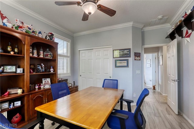 office area with ceiling fan, light wood-type flooring, and ornamental molding