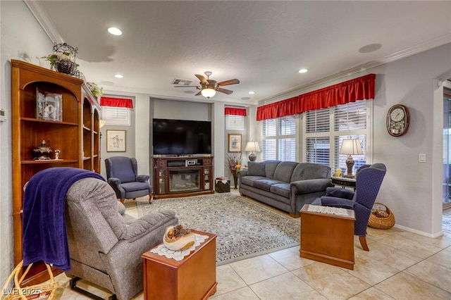 living room with light tile patterned floors, ceiling fan, and crown molding