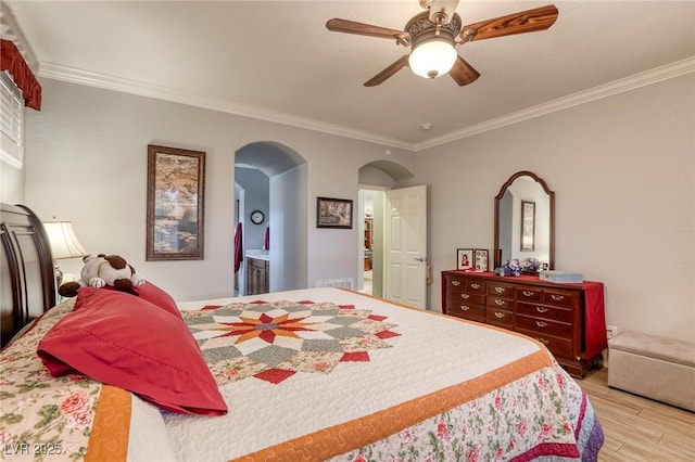 bedroom featuring ceiling fan, crown molding, and light hardwood / wood-style flooring