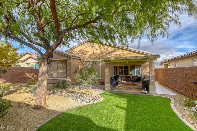 rear view of house with a patio area and a lawn