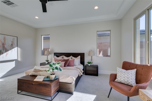 bedroom featuring light colored carpet and ceiling fan