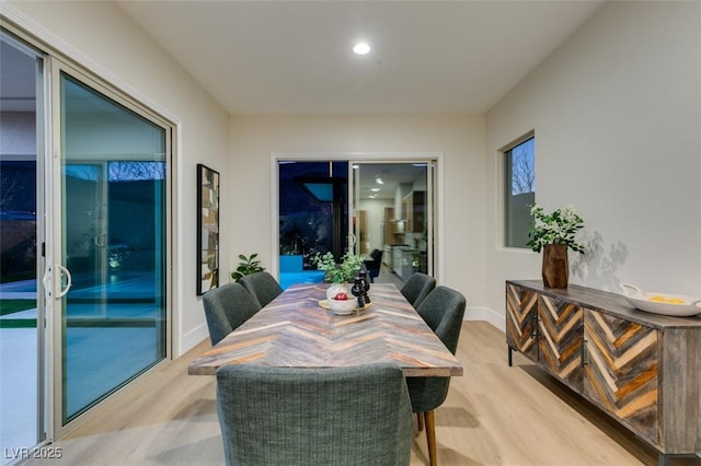 dining room with light hardwood / wood-style flooring