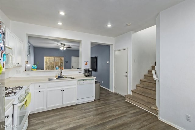 kitchen with white appliances, sink, ceiling fan, dark hardwood / wood-style flooring, and white cabinetry