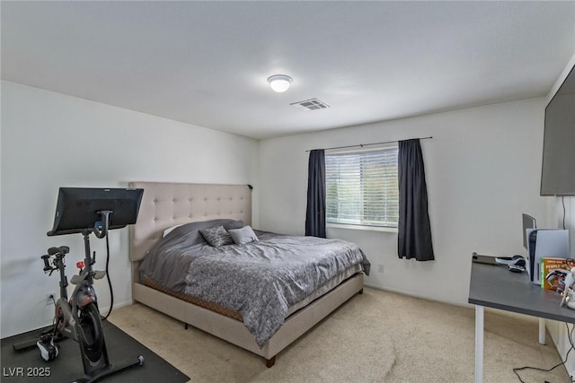 bedroom with light colored carpet