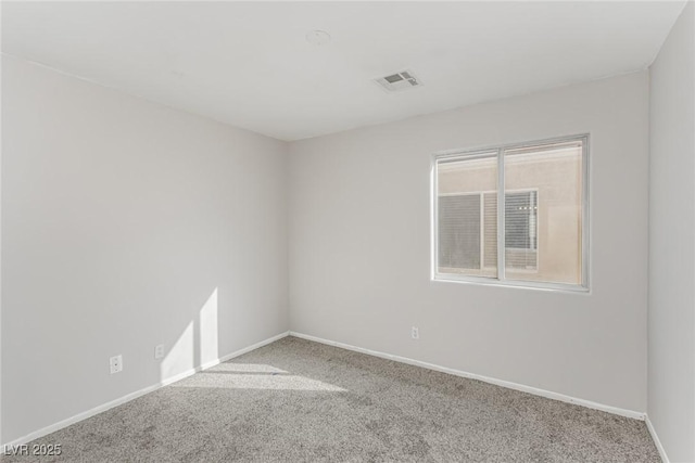 carpeted empty room with baseboards and visible vents