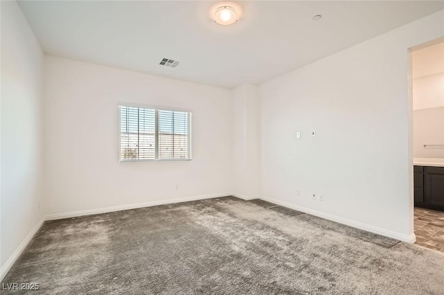 spare room with carpet floors