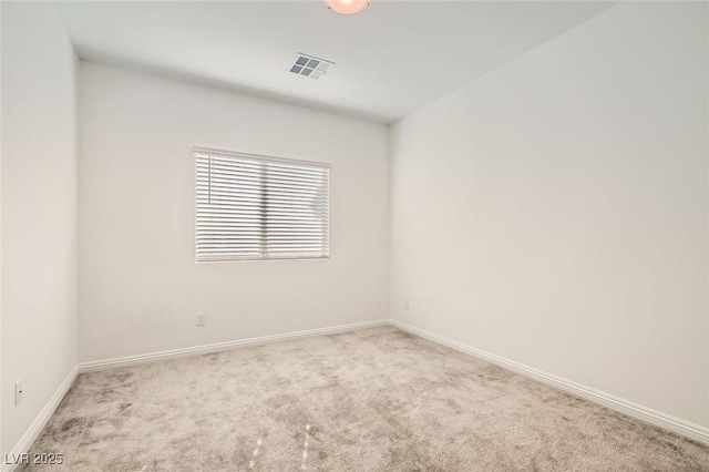 empty room featuring light carpet