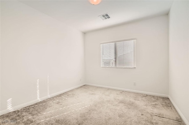 unfurnished room with light colored carpet