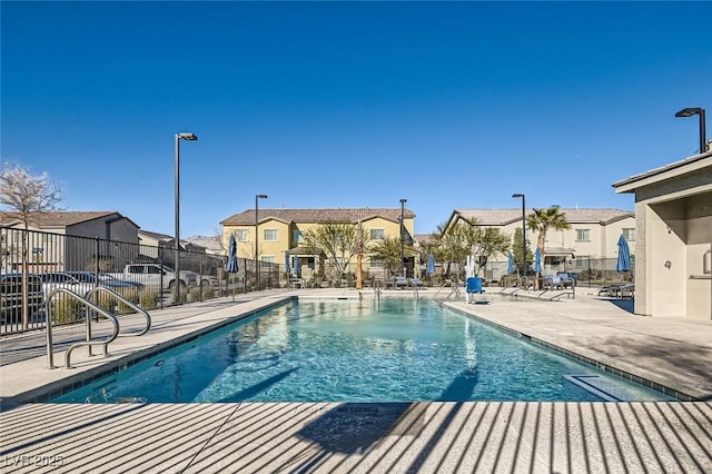 view of swimming pool featuring a patio area