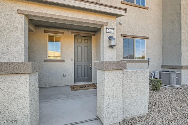 doorway to property with central air condition unit