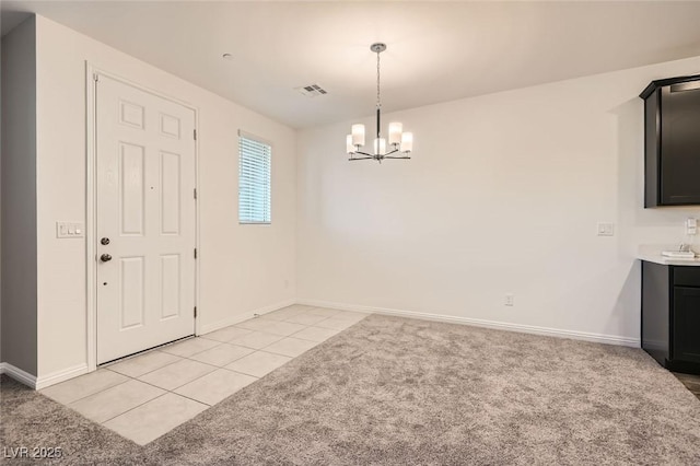 unfurnished dining area with light tile patterned flooring and a chandelier