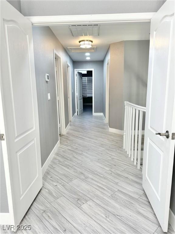 hallway featuring light hardwood / wood-style floors