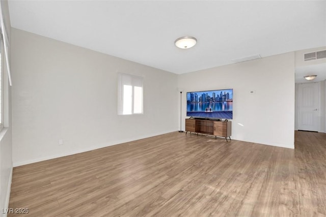 unfurnished living room with light wood-type flooring