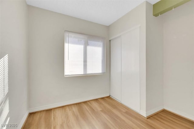 spare room with light wood-type flooring