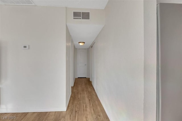 corridor featuring light hardwood / wood-style flooring