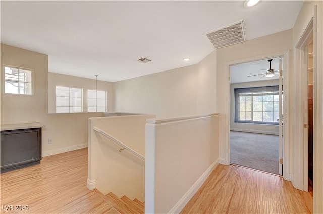 corridor featuring light hardwood / wood-style floors