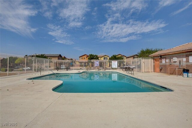 view of swimming pool with a patio