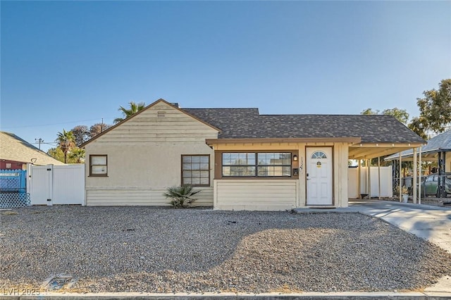 view of front facade with a carport