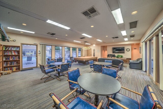 dining area featuring light colored carpet