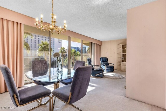 carpeted dining room with a textured ceiling and an inviting chandelier