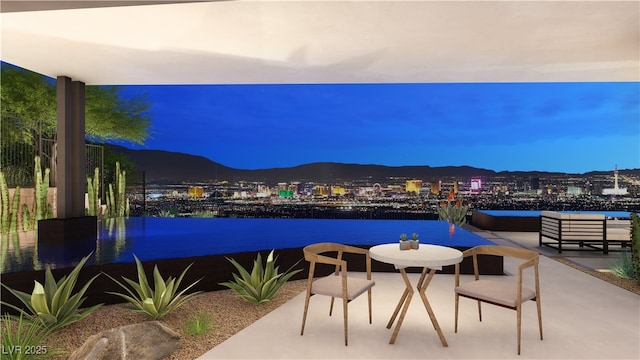 view of patio / terrace featuring a mountain view