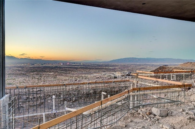 balcony at dusk with a mountain view