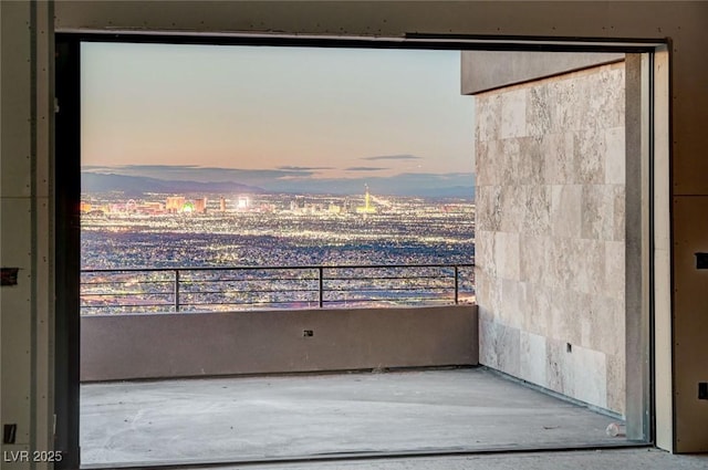 view of balcony at dusk