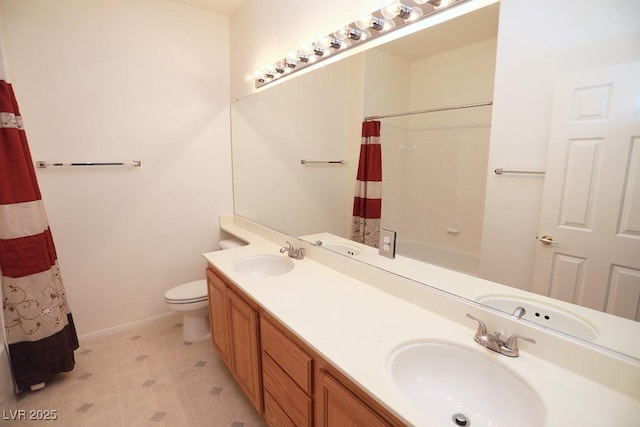 bathroom with toilet, vanity, and a shower with curtain