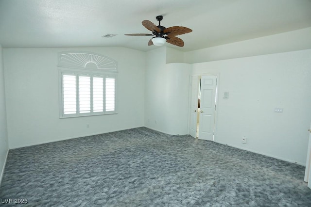 carpeted empty room with ceiling fan and lofted ceiling