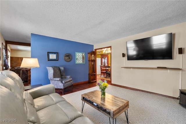 carpeted living room with a textured ceiling